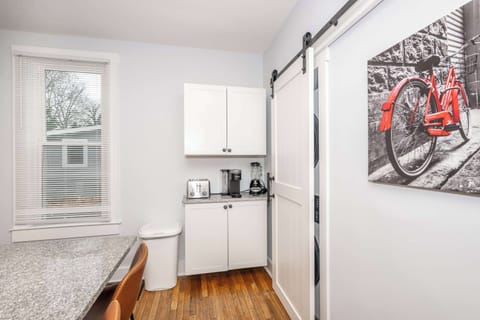 The chic, breezy kitchen offers ample space & every home comfort