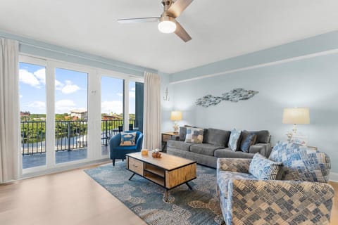 Relax in this modern living room with natural light and balcony views.