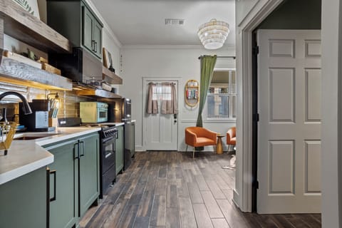 hallway from the bedroom that leads to separate living room, kitchen and bath