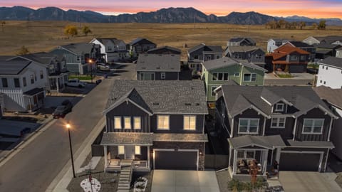 Twilight drone view showcasing the beauty of the property and surroundings.