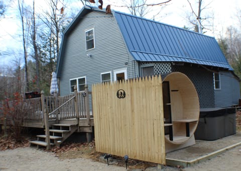 Exterior showing front of house with deck, Sauna and Hot tub