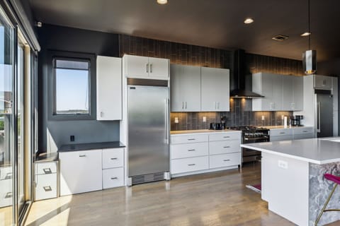Kitchen 1: Cook with a view! This modern kitchen offers stunning cityscapes while you create sumptuous meals.