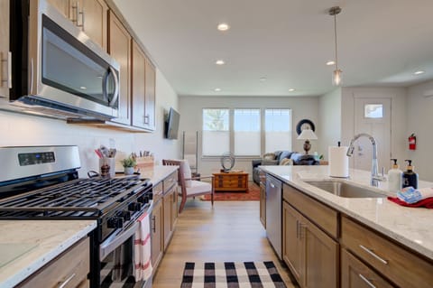 Kitchen: Spacious kitchen island with a built-in sink and ample counter space for cooking and entertaining.
