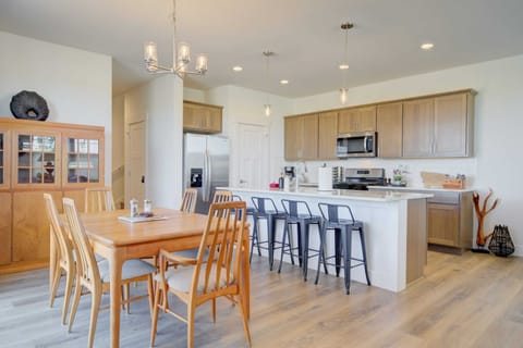 Dining Room: Bright and airy kitchen-dining combo with modern appliances and wooden accents.