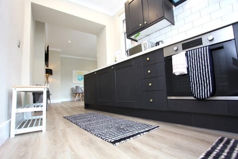 Modern kitchen fitted with ample items for guests