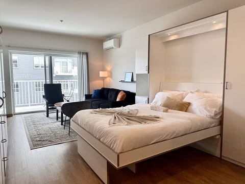 Smartly designed Murphy bed transforms the space in seconds—enjoy a comfortable night’s sleep without sacrificing daytime living space