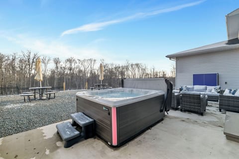 Outdoor hot tub perfect for evening relaxation under the stars.