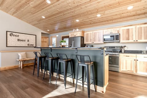 Fully equipped kitchen and island that seats four.