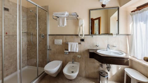 Shower, free toiletries, hair dryer, slippers