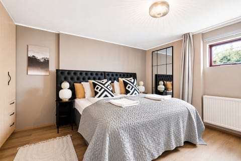 Our bedroom offers a cozy bed, providing a warm and inviting space for rest, complemented by a TV for your entertainment and relaxation.