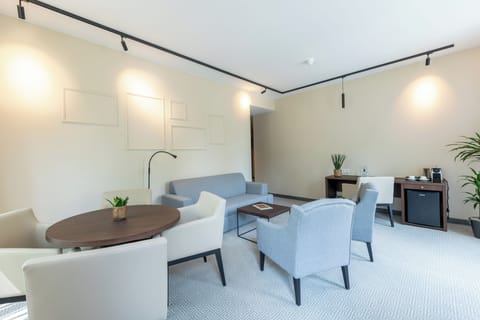 Suite | Living area | 42-inch LCD TV with satellite channels, TV, pay movies