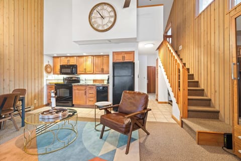 Spacious open living space with sofa sleeper, and gas fireplace