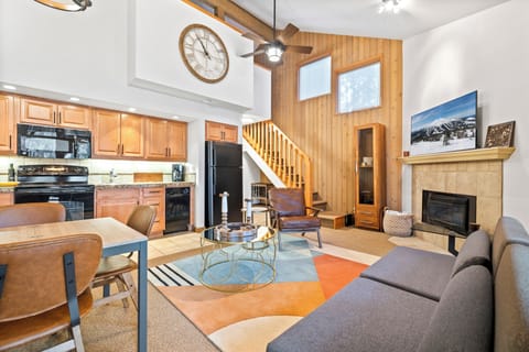 Spacious open living space with sofa sleeper and gas fireplace