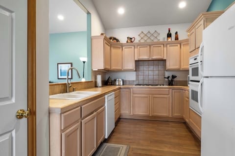 The kitchen offers ample space & all the comforts of home