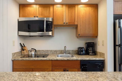 The open, airy kitchen has ample space & all the comforts of home