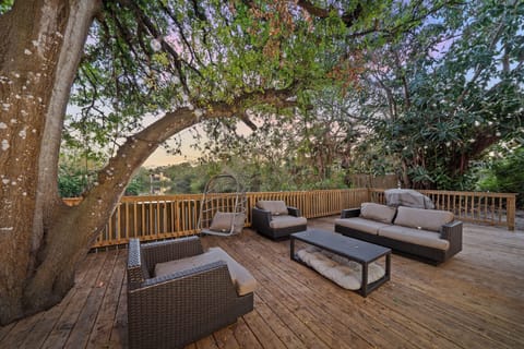 This outdoor deck with incredible seating just might be the best spot for your morning cup of coffee...