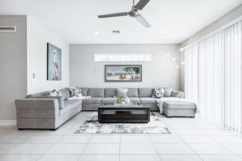 Unwind in this bright, open living room with a cozy sectional.