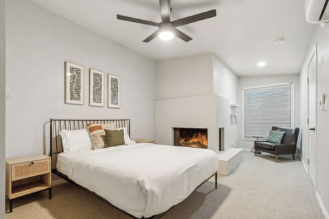 Get some amazing Z's in this comfy and spacious bedroom.  Sip your coffee with a good book by the fireplace and the oversized bay window too!