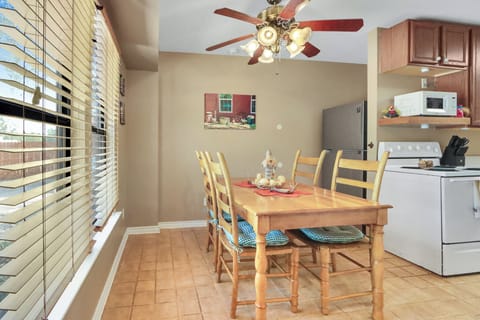 The kitchen is behind dining