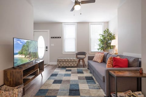 Living room with TV and comfy seating arrangement