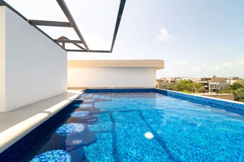 Soak up the sun in our stunning rooftop pool