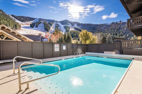 Heated pool and hot tub with views of the mountain