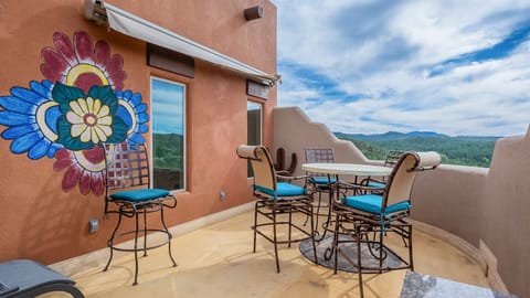 Drink up the views from the upstairs bedroom balcony