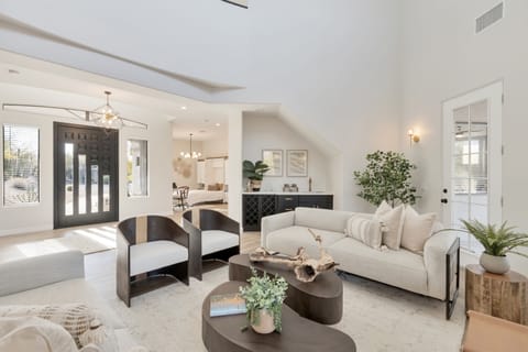 The impressive great room features a wet bar