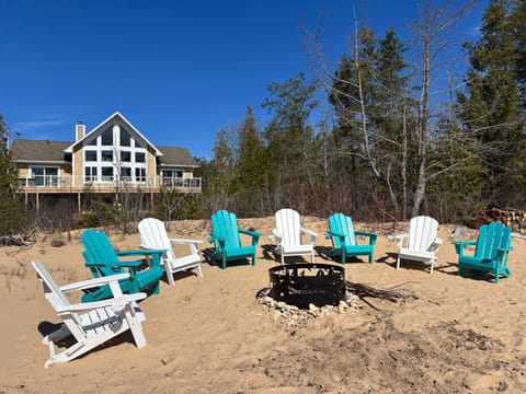 View of fire pit and house from beach