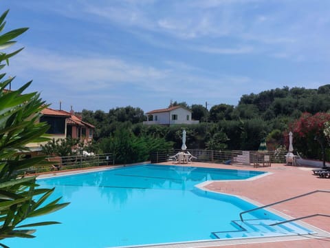 Water, Sky, Plant, Cloud, Swimming Pool, Tree, Natural Landscape, Leisure, Landscape, Resort Town