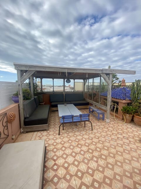 Furnished terrace with view of the city and the ocean in the distance