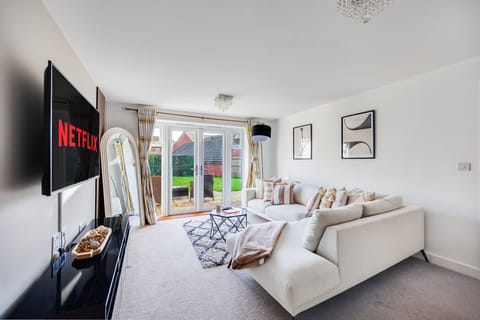 The living room features a large corner sofa and a 55'' Smart TV with Sky TV and Netflix subscriptions included