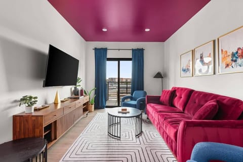 Living Room: complete with a sleeper sofa and smart TV.
