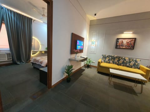 Luxury Studio Suite, City View | Living area | TV, printers