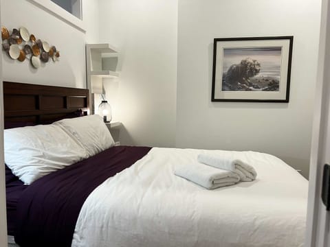 Beautifully styled bedroom with a queen bed that guarantees restful nights.