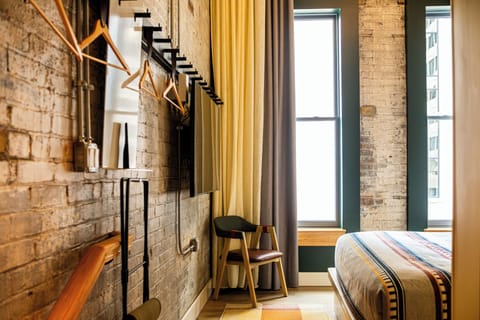 Chasing HIStory | Desk, laptop workspace, blackout drapes, iron/ironing board