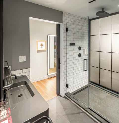 Suite Home Zincinnati | Bathroom | Shower, hydromassage showerhead, hair dryer, towels