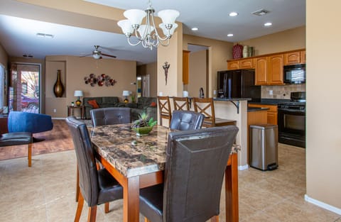 Dining Table With The Two Extra Seats Will Accommodate 6 with 3 Extra at The Bar