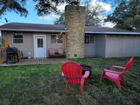 The backyard has plenty of space for relaxing or other activities.