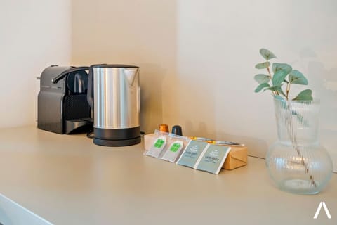  Desk space with a coffee maker and kettle for added convenience.