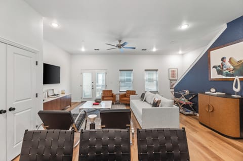 Kick back in a stylish, open-concept living space designed for comfort and connection. Whether you're debriefing after a Rangers game, watching pre-game coverage on the smart TV, or just relaxing with your crew—The Ryan's living area has you covered.