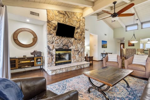Living Room with a leather sofa and equipped with a 65” Roku Smart TV