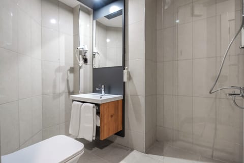 Shower, hair dryer, slippers, towels