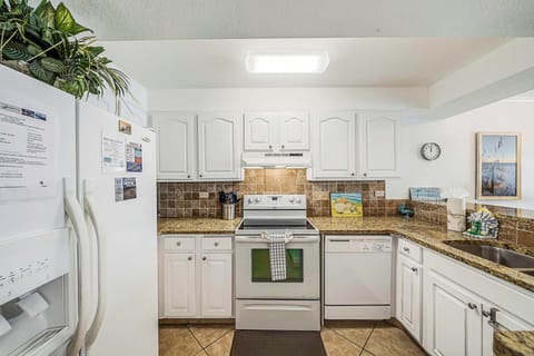 The fully equipped kitchen features granite countertops and has everything you need to prepare meals for family & friends.