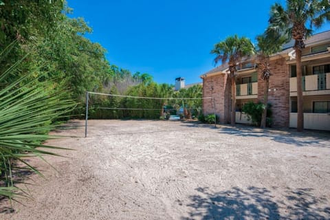 Resort-style amenities including a pool, spa, and volleyball court for your enjoyment.