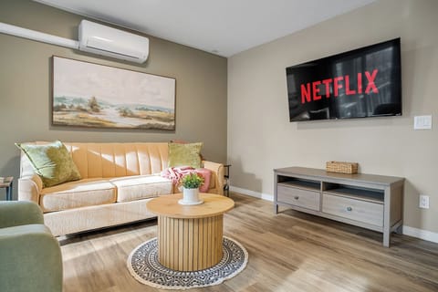 Relax in this bright, cozy living room with comfortable seating and a Smart TV