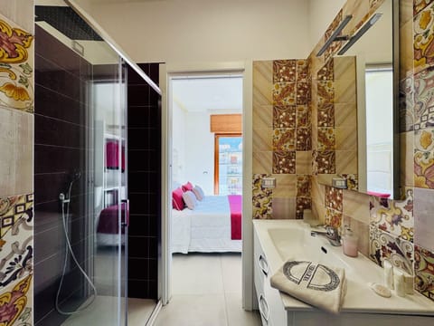 Deluxe Double Room, Balcony, City View | Bathroom | Shower, hair dryer, towels, soap