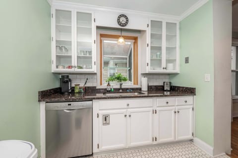 The bright, airy kitchen offers ample space & all the comforts of home