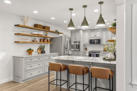 Additional seating for 3 at the kitchen bar in the adjacent room.