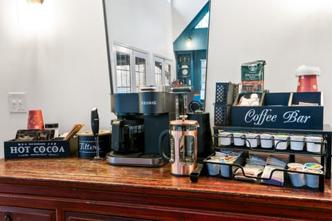 Fully stocked coffee bar with drip and Keurig coffees, sugars, creamer etc.